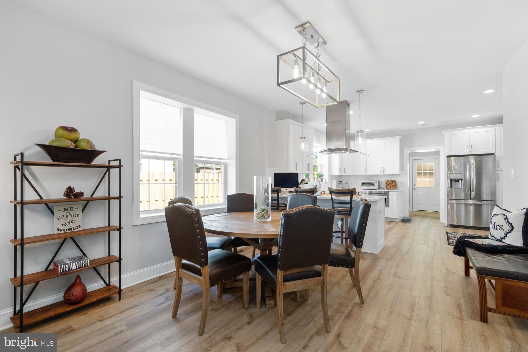528 Lower E Valley Forge Road King of Prussia, PA 19406 - Photo 9 of 40 a view of a dining room with furniture window and wooden floor