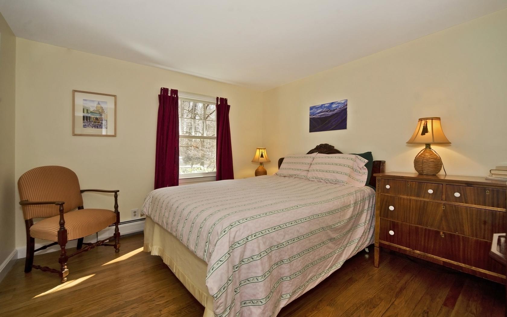 25 Timber Top Trail Wilton, CT 06897 - Photo 11 of 25 a bedroom with bed and chair with wooden floor