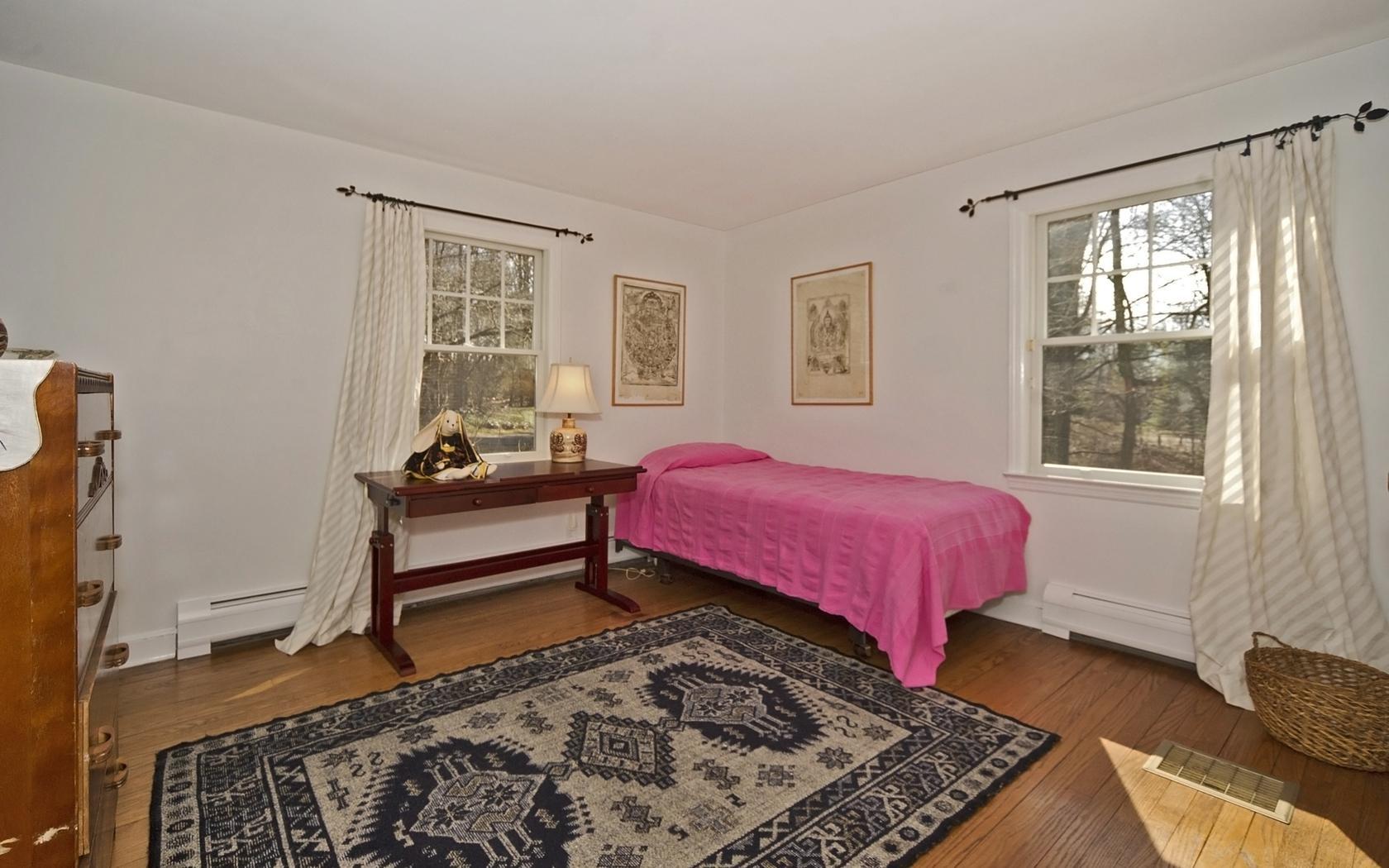 25 Timber Top Trail Wilton, CT 06897 - Photo 13 of 25 a bedroom with a bed and wooden floor