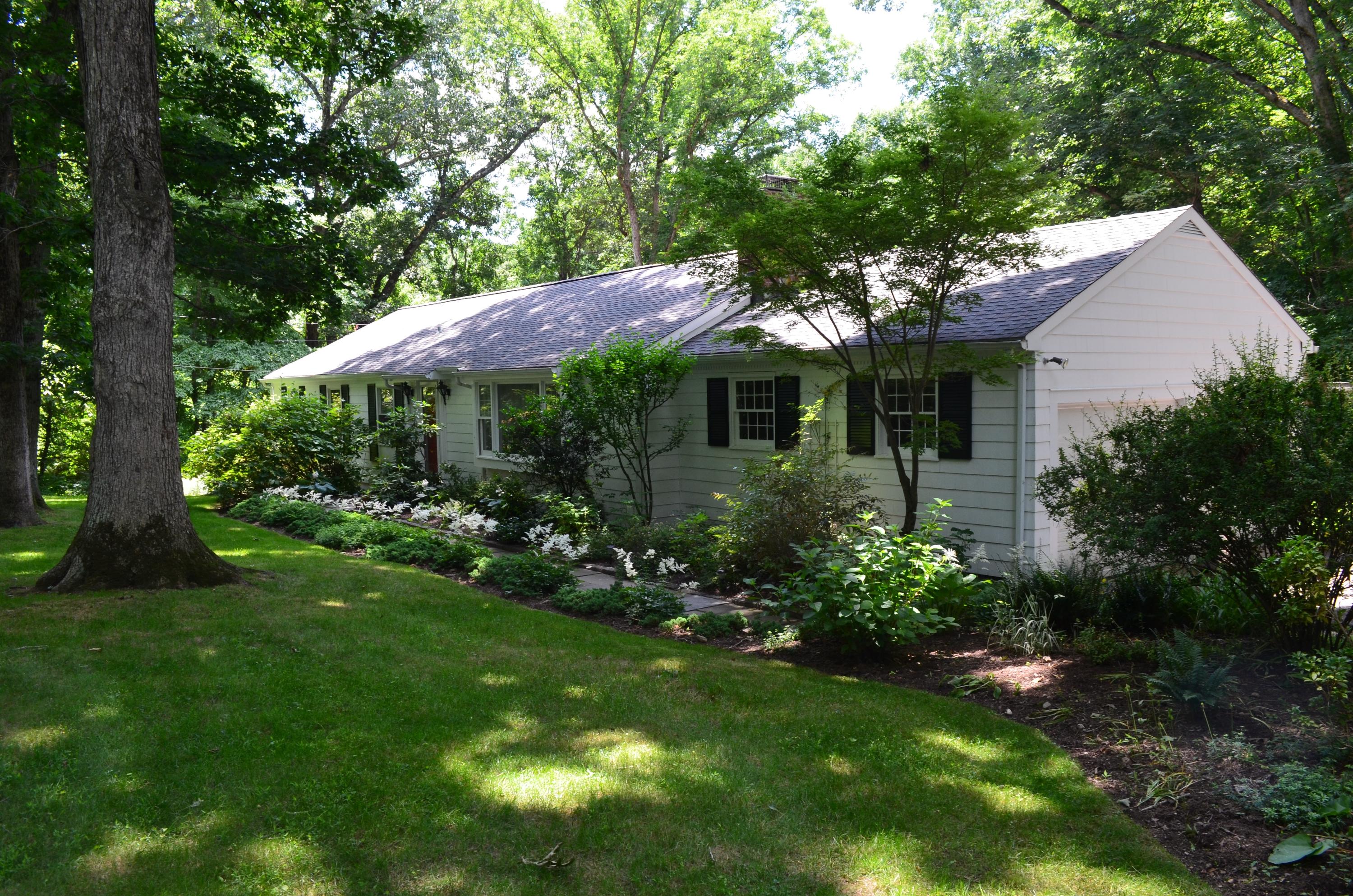 25 Timber Top Trail Wilton, CT 06897 - Photo 24 of 25 a view of a house with a yard and potted plants