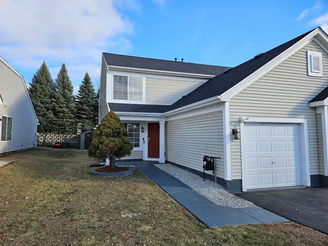 a view of a house with backyard and garden