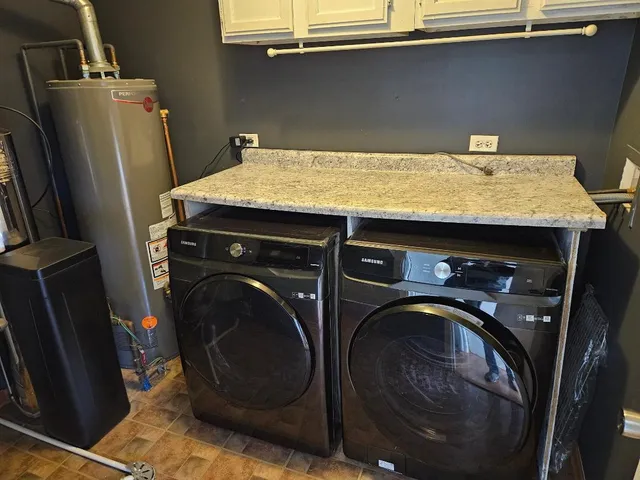 a utility room with dryer and washer