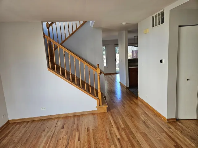 a view of entryway with wooden floor