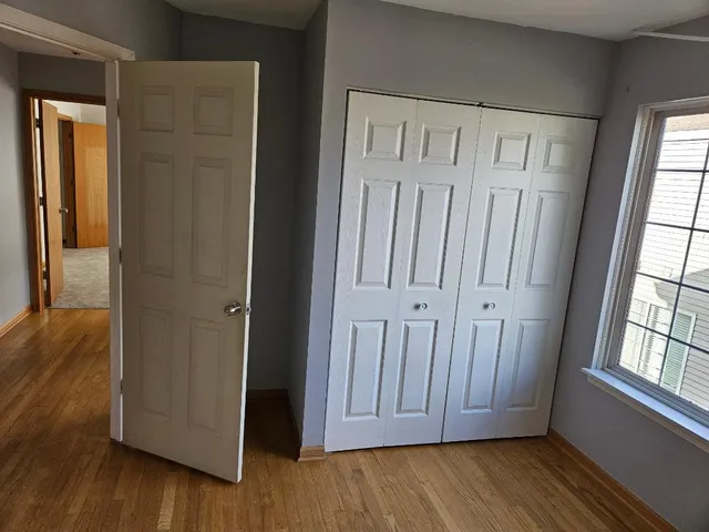 a view of front door with wooden floor