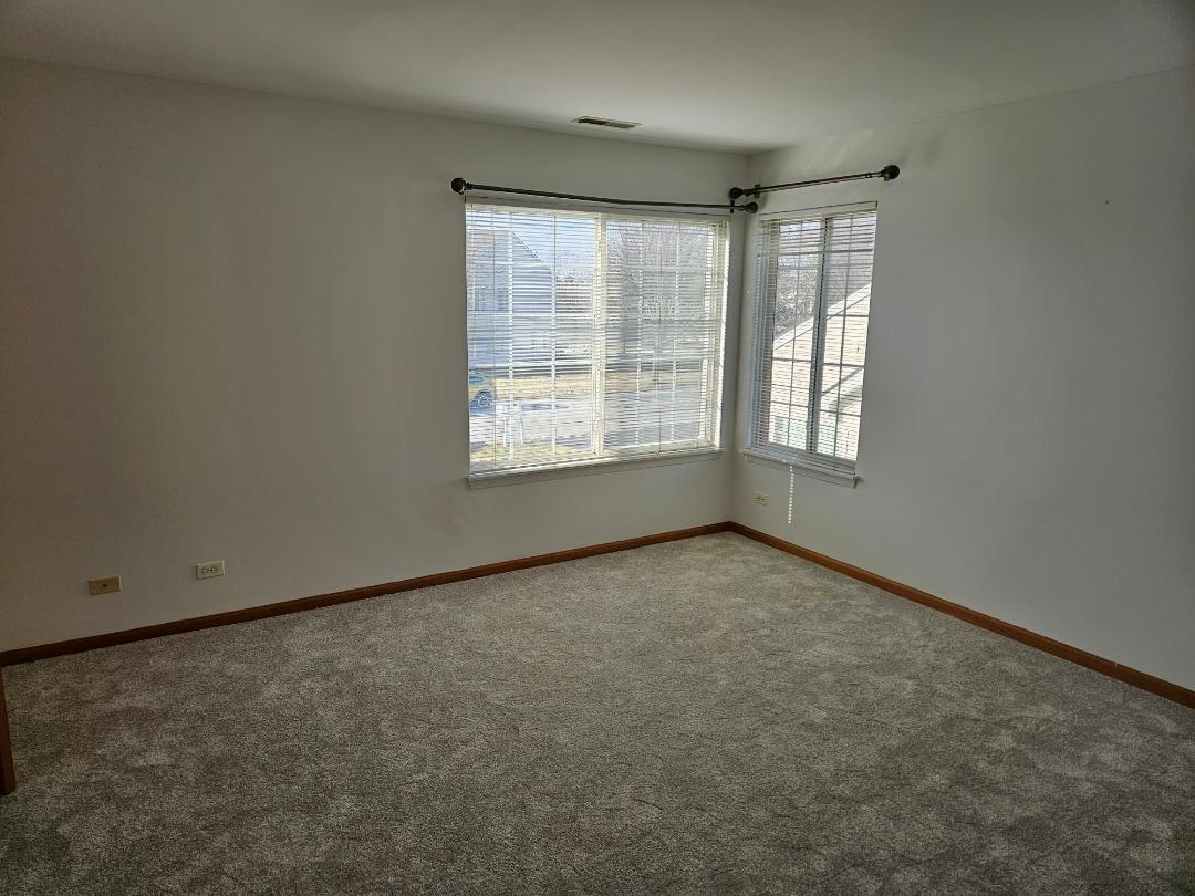 10 Ronan Court, Unit 10 Lake In The Hills, IL 60156 - Photo 9 of 20 an empty room with a window
