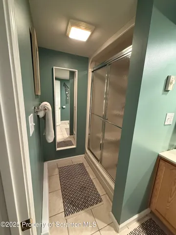 a view of hallway with mirror