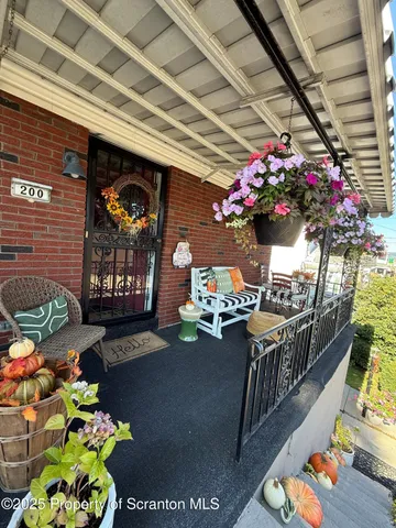 a outdoor living space with furniture and flowers