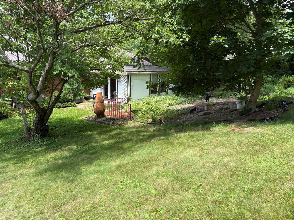 347 Howes Run Road Sarver, PA 16055 - Photo 3 of 16 a front view of a house with a garden