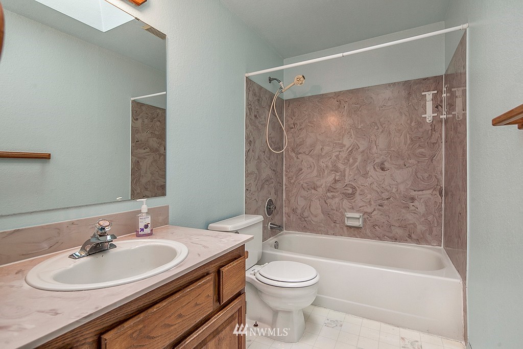 623 Harvest Road Bothell, WA 98012 - Photo 6 of 11 a bathroom with a sink mirror toilet and bathtub