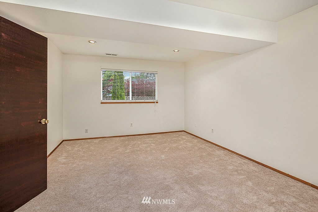 623 Harvest Road Bothell, WA 98012 - Photo 8 of 11 an empty room with a window