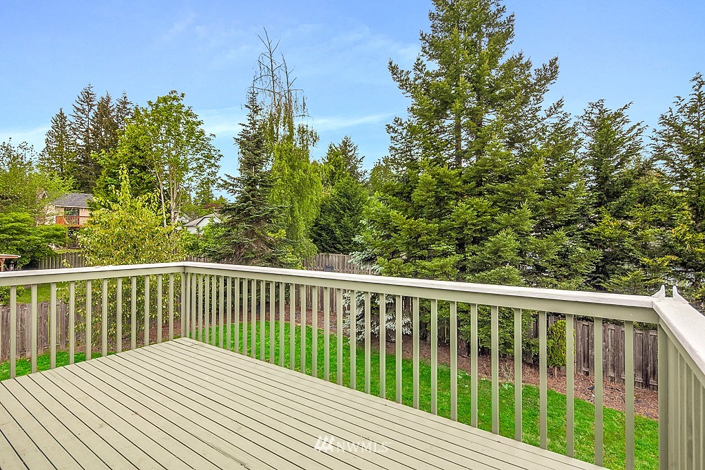623 Harvest Road Bothell, WA 98012 - Photo 10 of 11 a balcony with trees in front of it