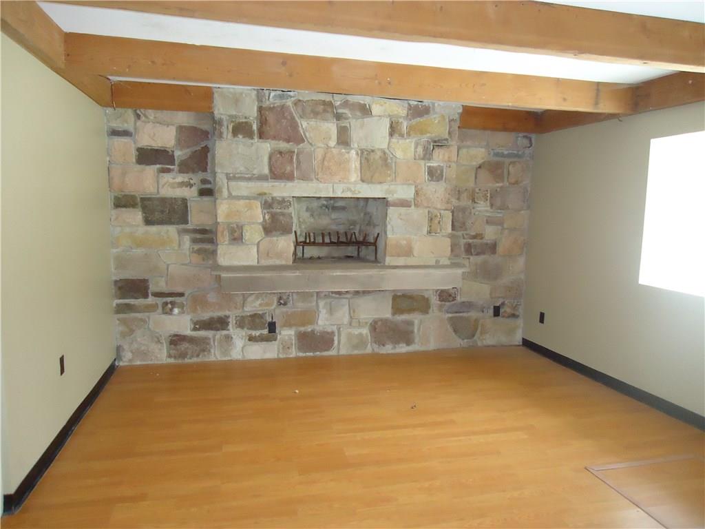 569 Austraw Road Ligonier, PA 15658 - Photo 14 of 25 Main Level Den. Elevated All Stone Fireplace, Beamed Ceiling.