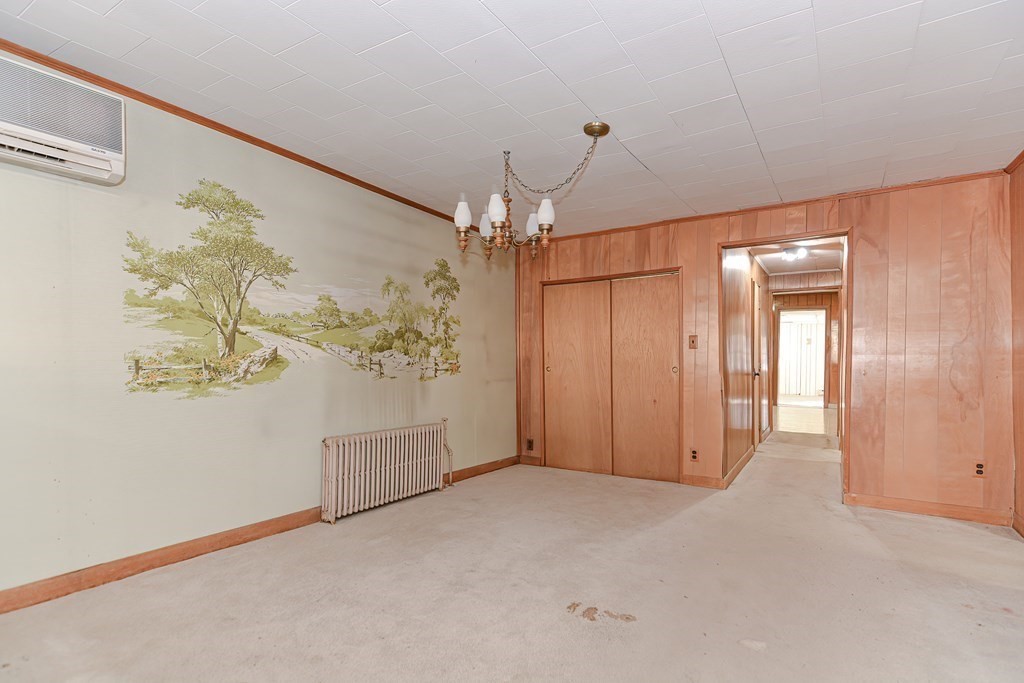 291 Sumner Street Boston, MA 02128 - Photo 13 of 41 a view of a hallway with a chandelier