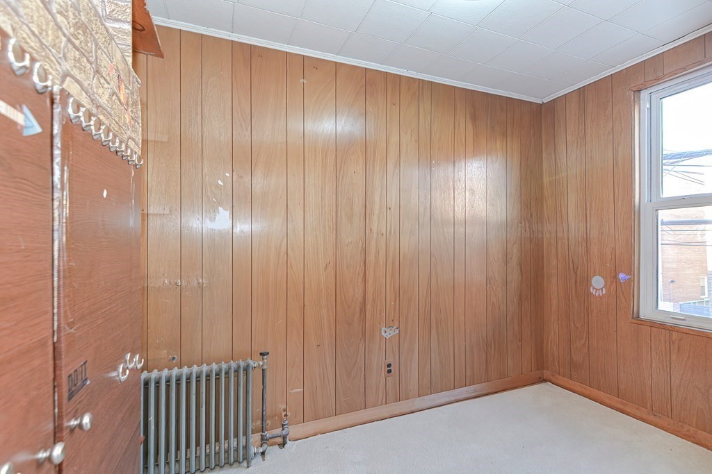 291 Sumner Street Boston, MA 02128 - Photo 20 of 41 a view of an empty room with a window