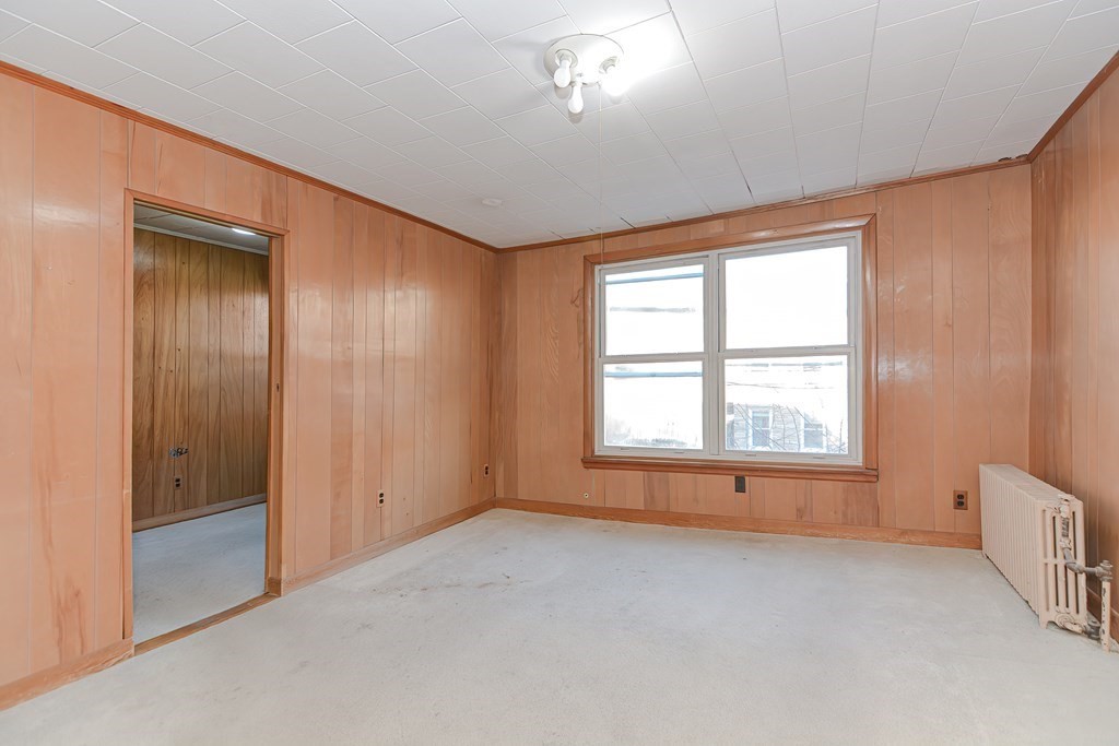 291 Sumner Street Boston, MA 02128 - Photo 21 of 41 an empty room with a empty space and windows