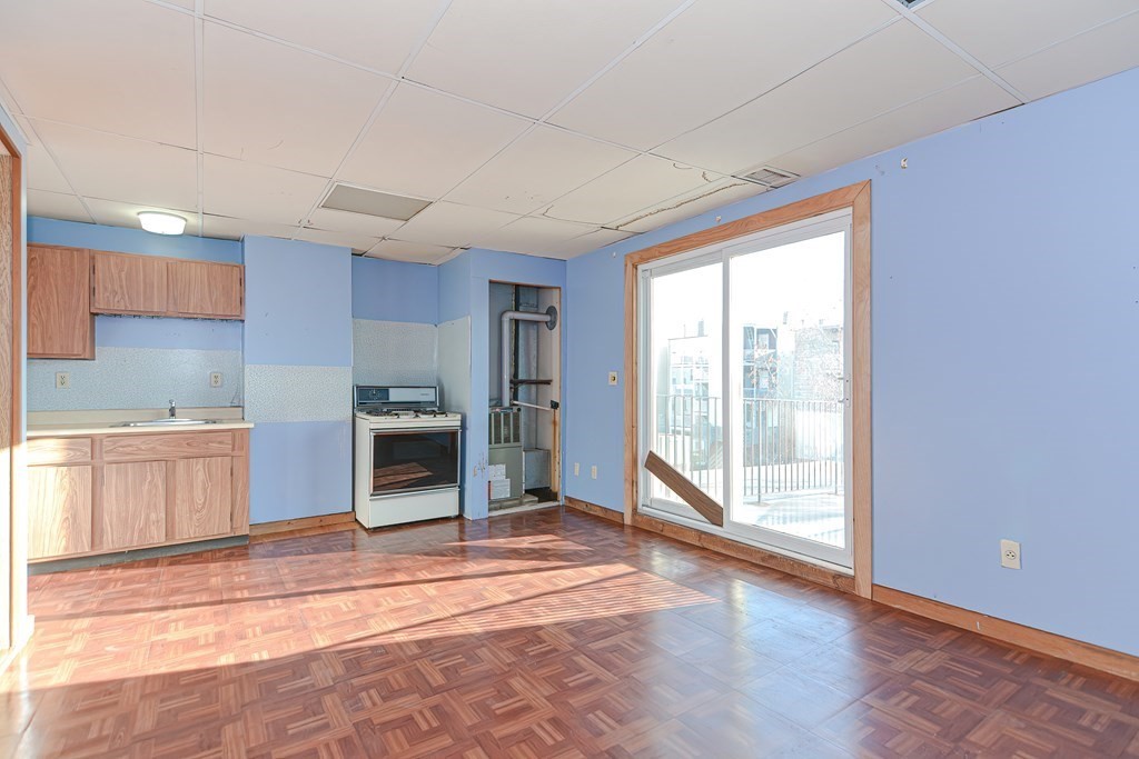 291 Sumner Street Boston, MA 02128 - Photo 23 of 41 a view of a kitchen with a sink and a window