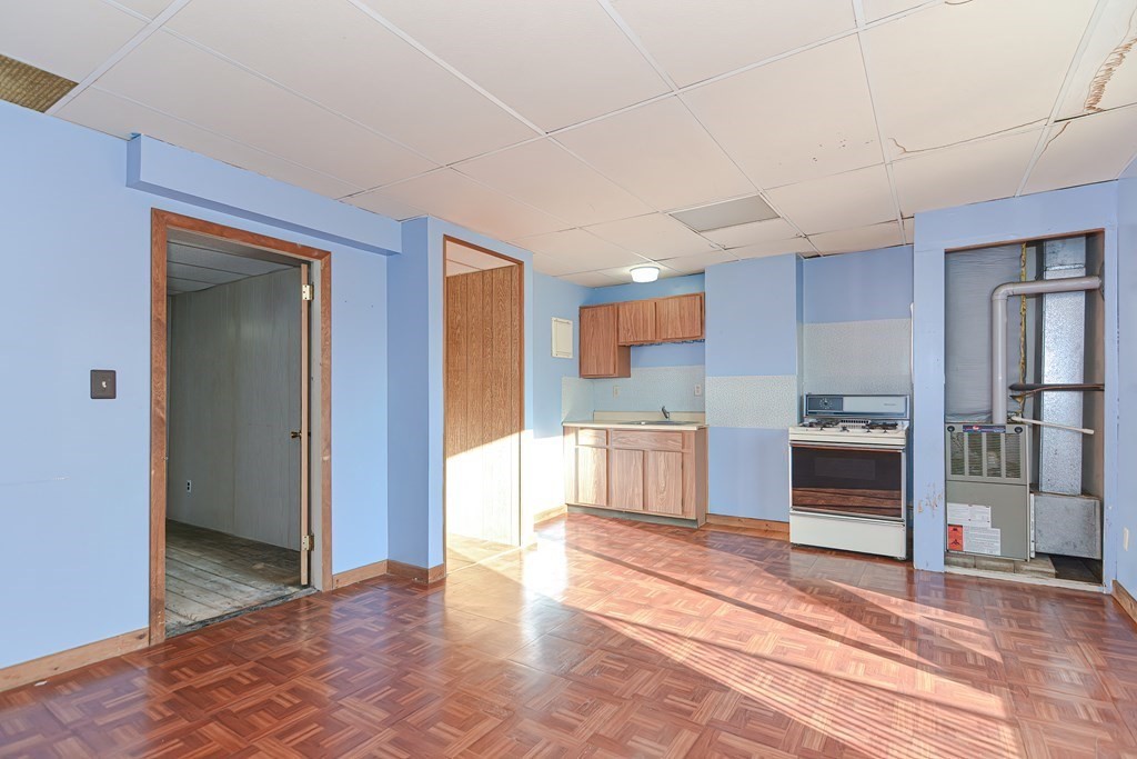 291 Sumner Street Boston, MA 02128 - Photo 25 of 41 a view of a kitchen with a sink and a refrigerator