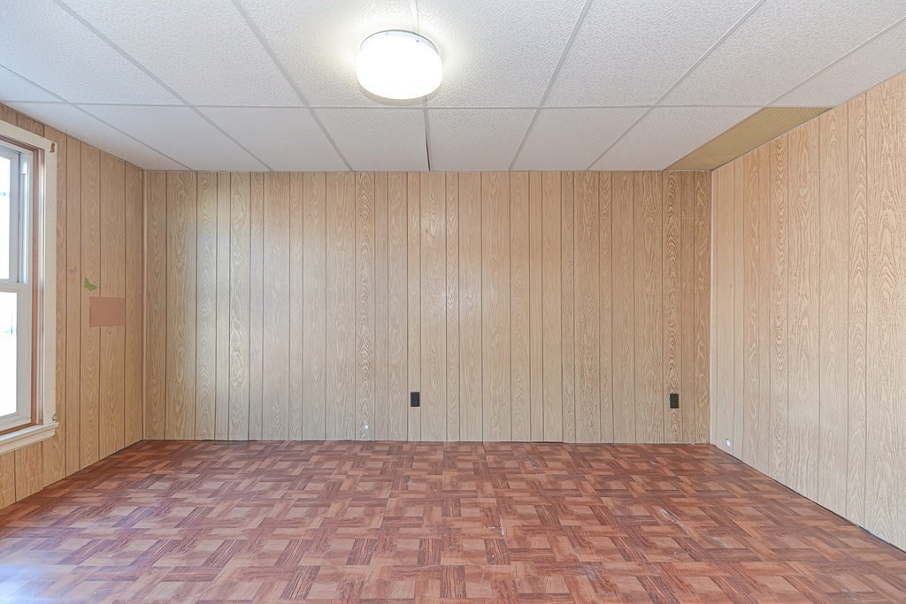291 Sumner Street Boston, MA 02128 - Photo 31 of 41 a view of an empty room with a window
