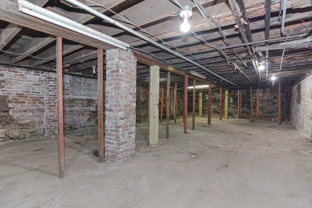 291 Sumner Street Boston, MA 02128 - Photo 38 of 41 a view of an empty room with wooden walls