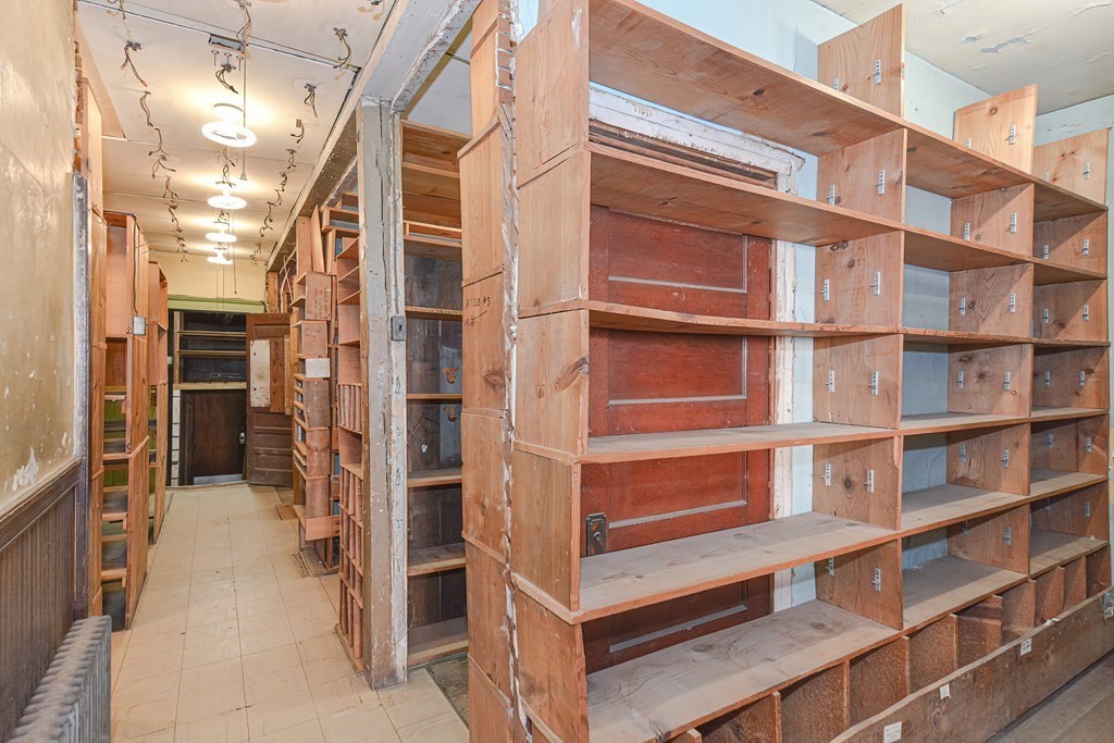 291 Sumner Street Boston, MA 02128 - Photo 10 of 41 a view of walk in closet with empty racks
