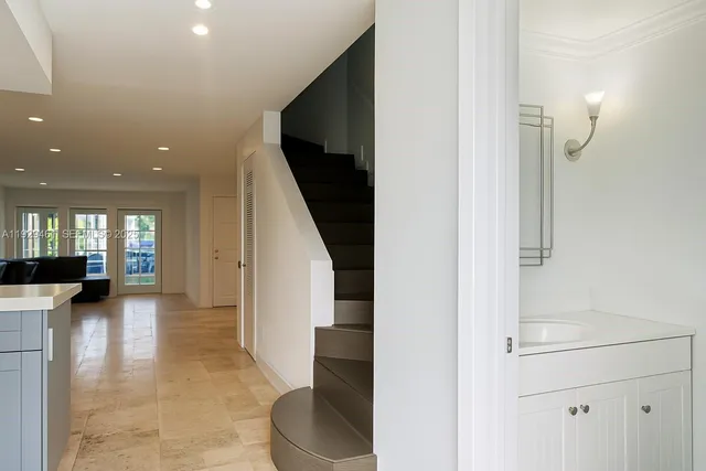 a view of a living room with furniture and wooden floor