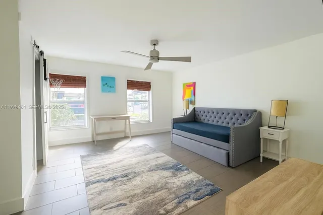 a living room with furniture and a window