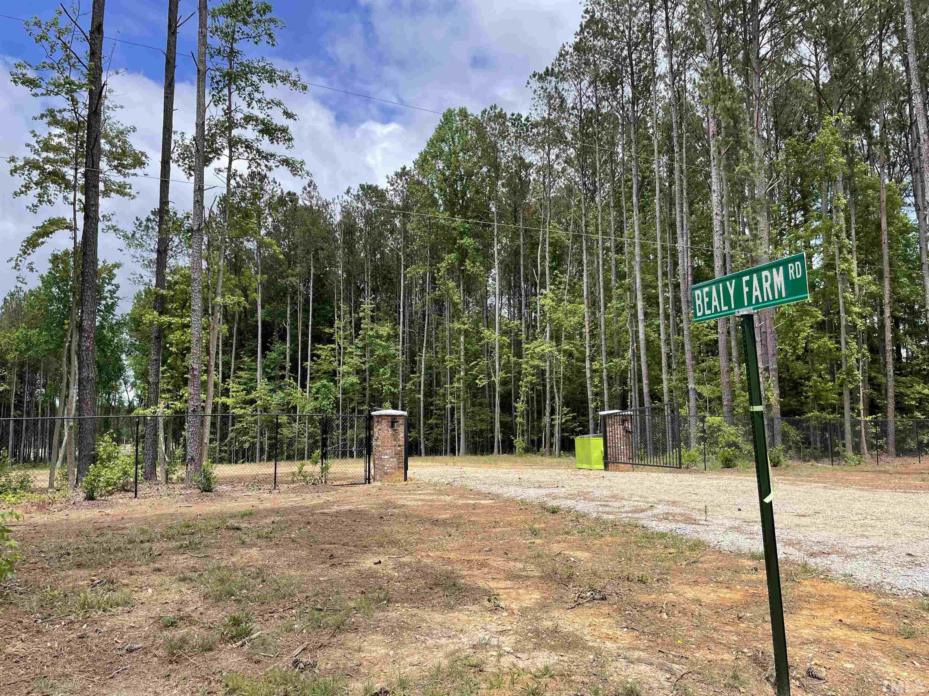 230 Bealy Farm Road Zebulon, NC 27597 - Photo 2 of 11 a view of outdoor space and tall trees