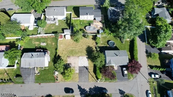 an aerial view of a house with a garden
