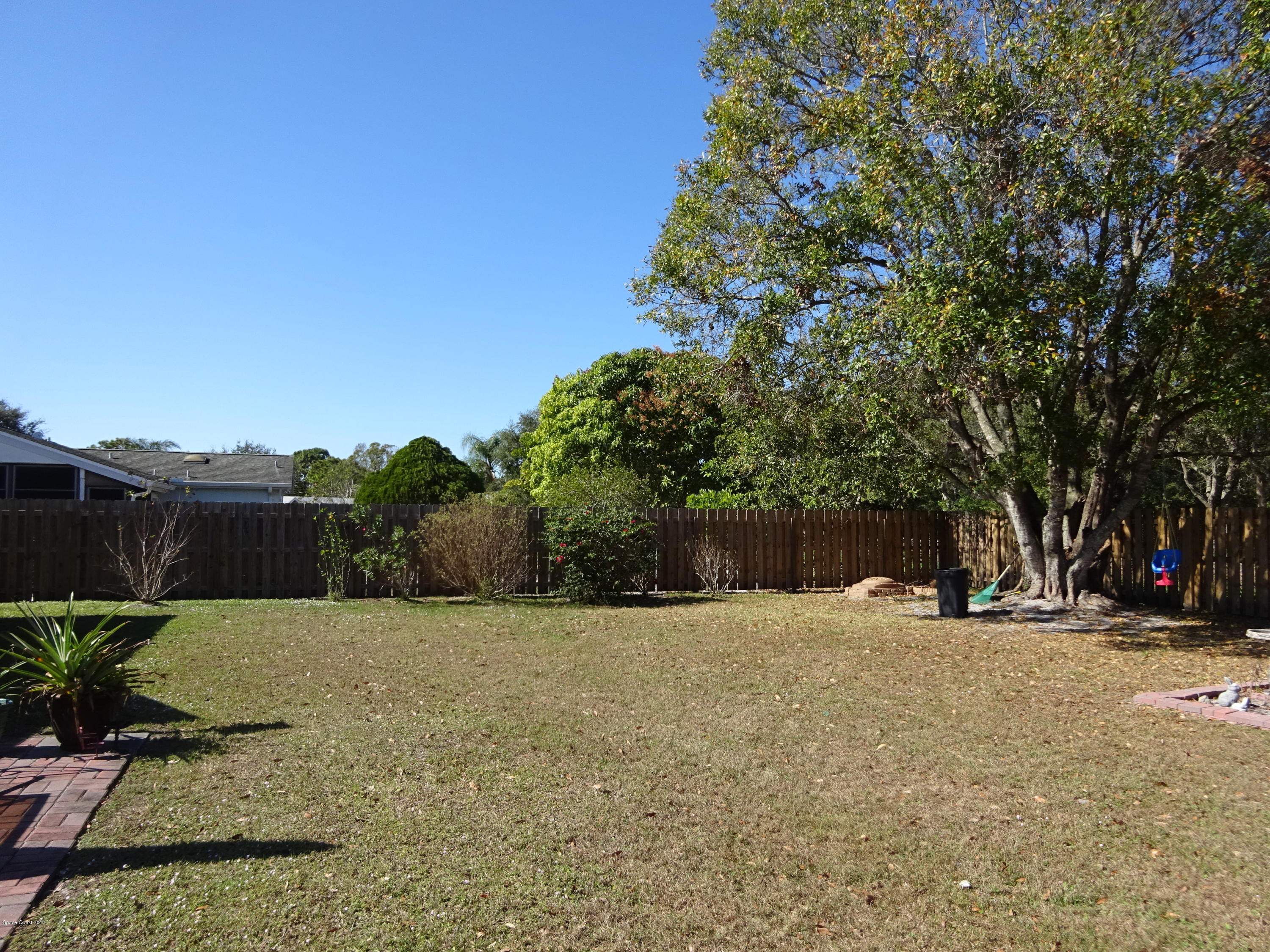 1349 Freil Road Northeast Palm Bay, FL 32905 - Photo 3 of 22 Back Yard West View
