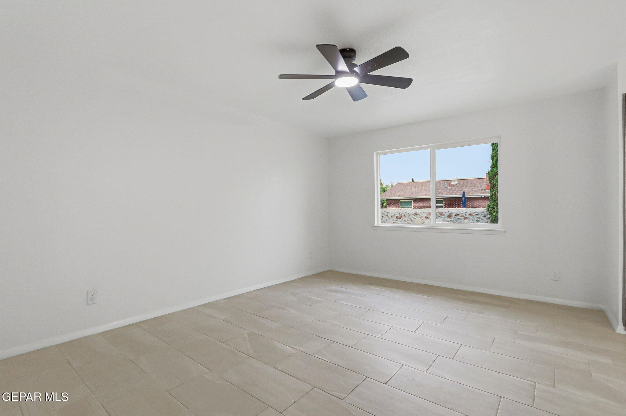709 Frontera Road El Paso, TX 79922 - Photo 32 of 41 an empty room with windows and fan