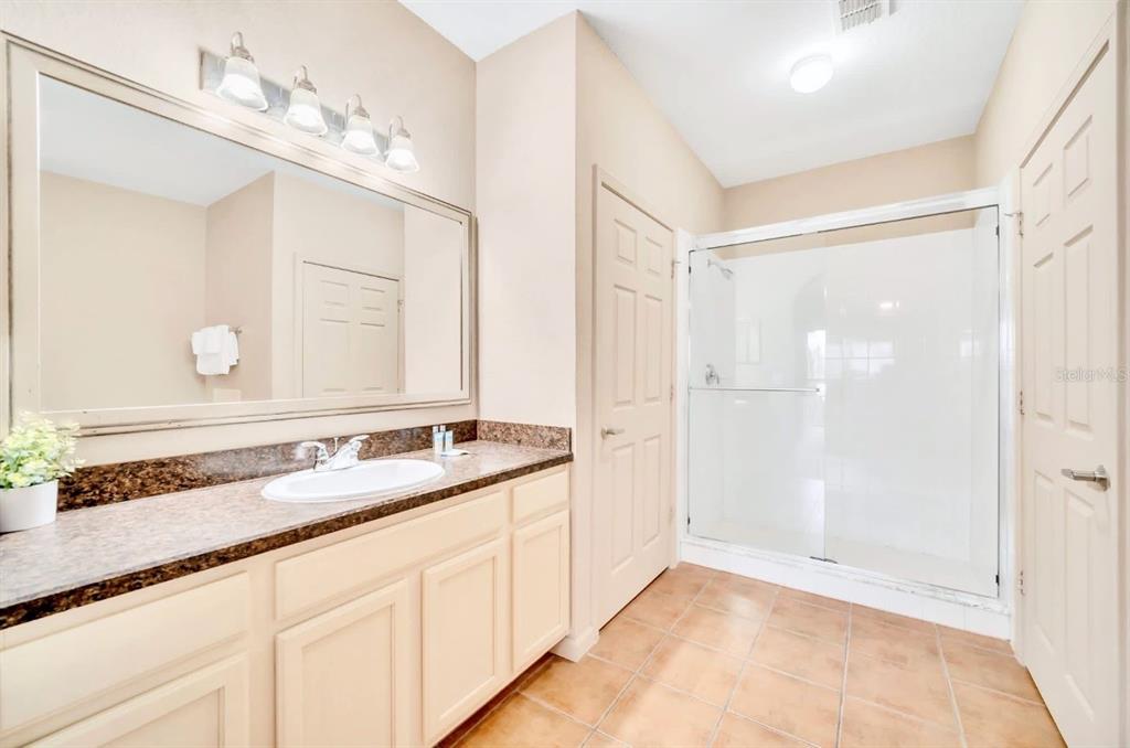 14200 Avalon Road, Unit 426 Winter Garden, FL 34787 - Photo 13 of 44 a bathroom with a sink and a mirror