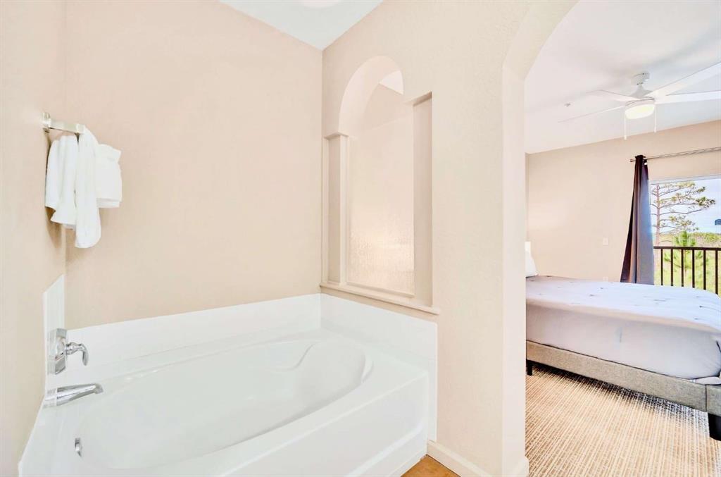 14200 Avalon Road, Unit 426 Winter Garden, FL 34787 - Photo 14 of 44 a bathroom with a bathtub and shower