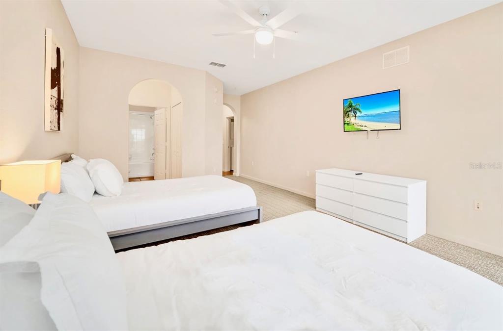 14200 Avalon Road, Unit 426 Winter Garden, FL 34787 - Photo 16 of 44 a bedroom with a bed and a lamp