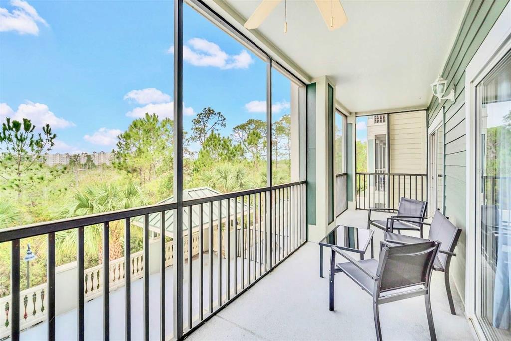 14200 Avalon Road, Unit 426 Winter Garden, FL 34787 - Photo 19 of 44 a view of a chair and table in the balcony