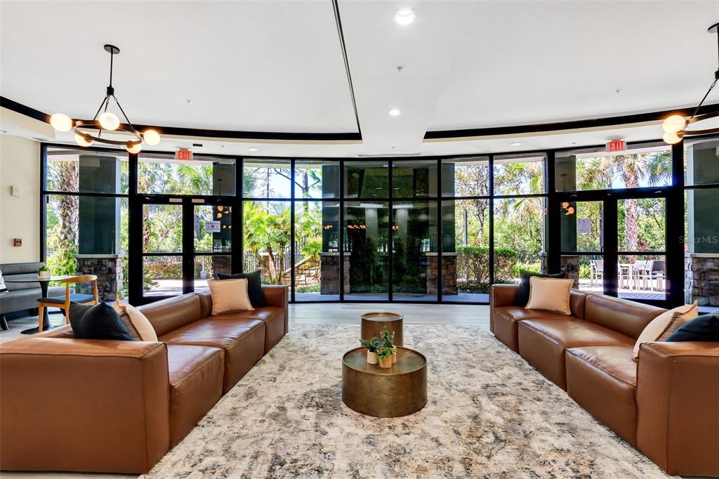 14200 Avalon Road, Unit 426 Winter Garden, FL 34787 - Photo 24 of 44 a living room with furniture and a large window
