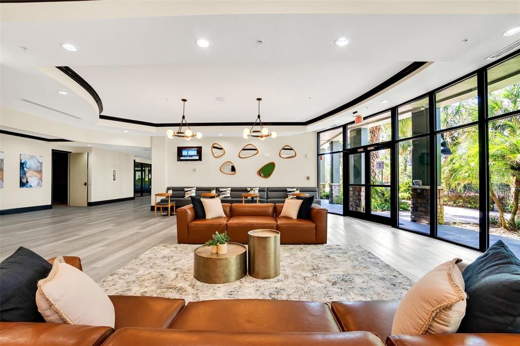 14200 Avalon Road, Unit 426 Winter Garden, FL 34787 - Photo 25 of 44 a living room with furniture or couch and a large window