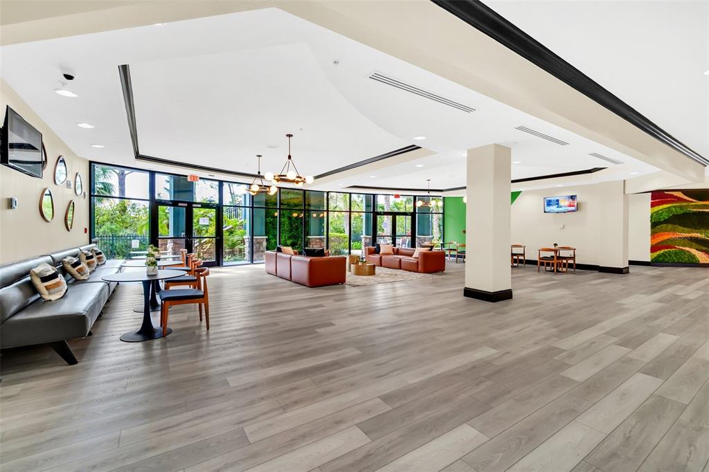 14200 Avalon Road, Unit 426 Winter Garden, FL 34787 - Photo 27 of 44 a living room with furniture and a large window