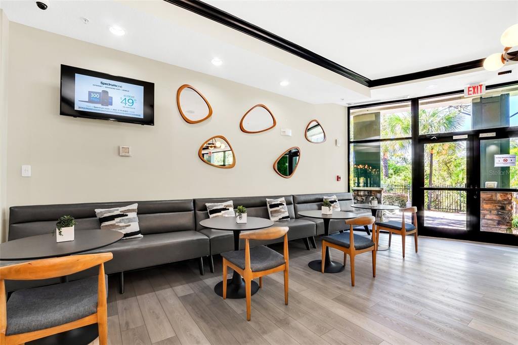 14200 Avalon Road, Unit 426 Winter Garden, FL 34787 - Photo 28 of 44 a living room with furniture and wooden floor