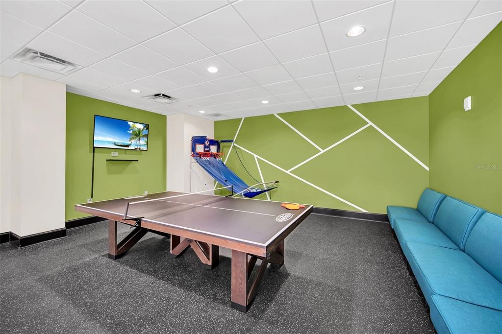 14200 Avalon Road, Unit 426 Winter Garden, FL 34787 - Photo 37 of 44 a room with furniture and air hockey table