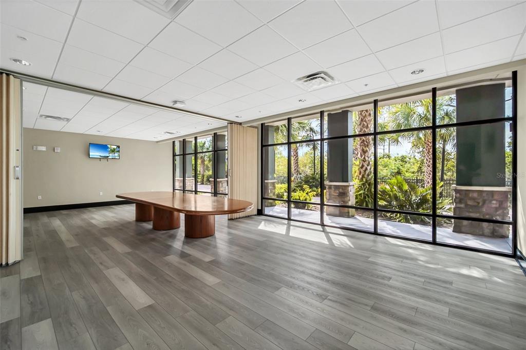 14200 Avalon Road, Unit 426 Winter Garden, FL 34787 - Photo 39 of 44 a view of an empty room with wooden floor and a window
