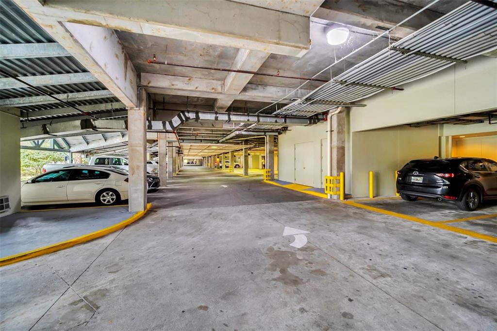 14200 Avalon Road, Unit 426 Winter Garden, FL 34787 - Photo 40 of 44 a view of parking garage with cars