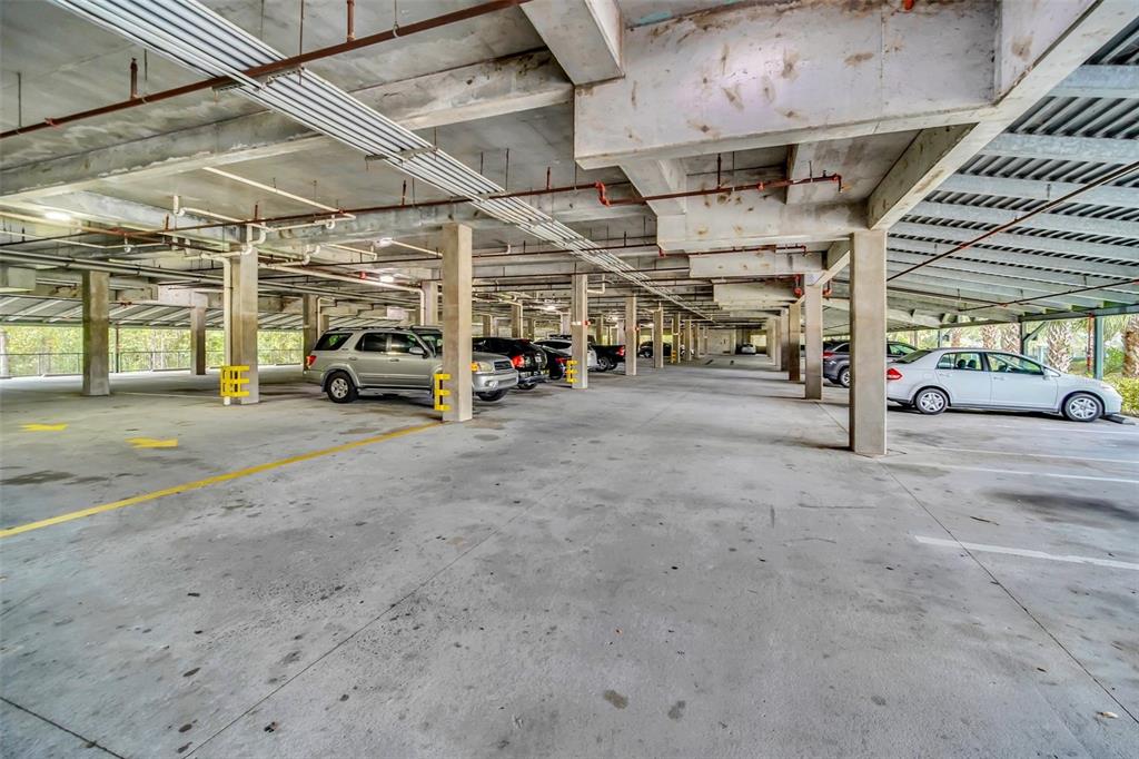14200 Avalon Road, Unit 426 Winter Garden, FL 34787 - Photo 43 of 44 a view of parking garage with cars