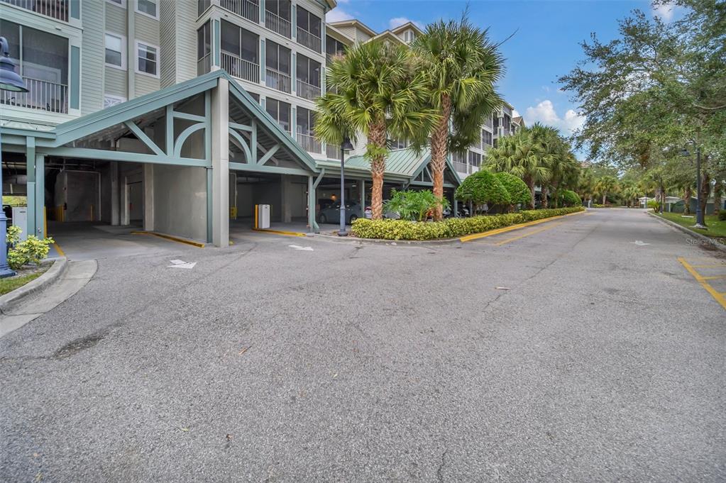 14200 Avalon Road, Unit 426 Winter Garden, FL 34787 - Photo 44 of 44 a front view of a house with a yard and a garage