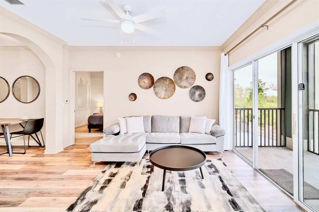 14200 Avalon Road, Unit 426 Winter Garden, FL 34787 - Photo 5 of 44 a living room with furniture and a large window