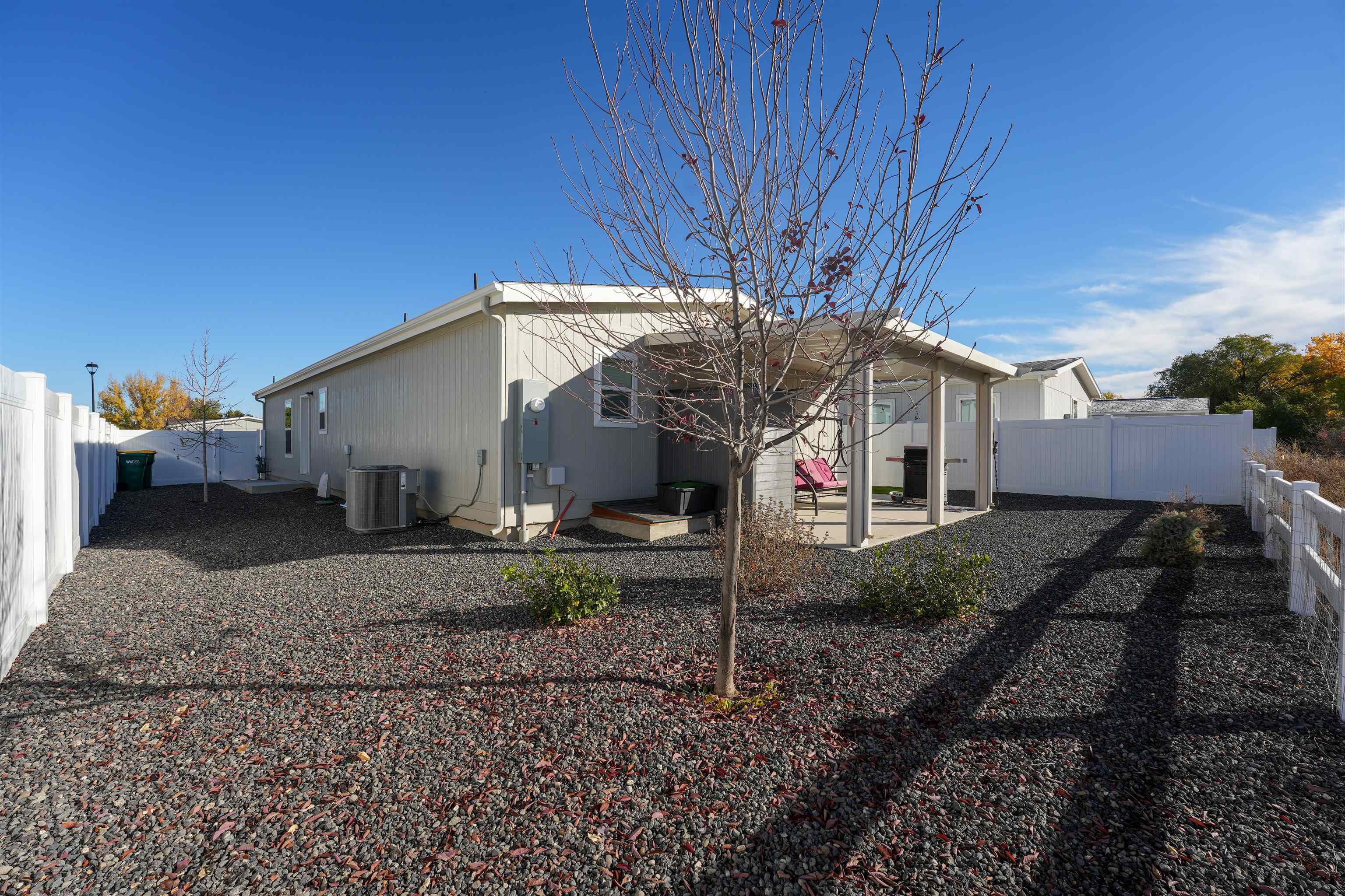 264 Holly Berry Way Fruita, CO 81521 - Photo 20 of 27 a view of a house with a yard