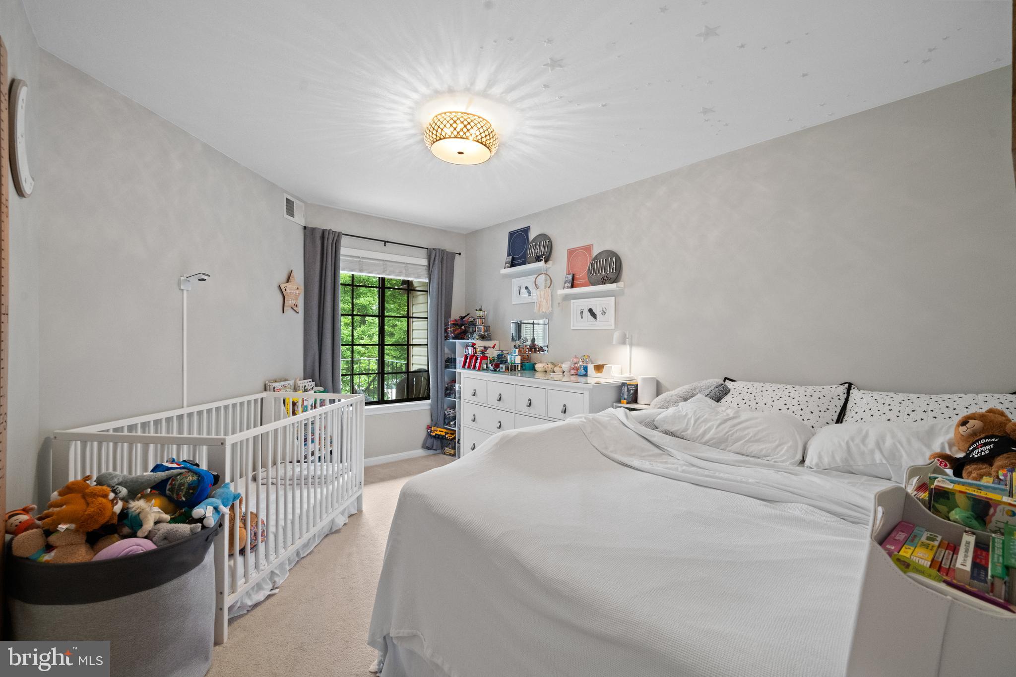 6022 Curtier Drive, Unit E Alexandria, VA 22310 - Photo 20 of 38 a bedroom with a bed and a window