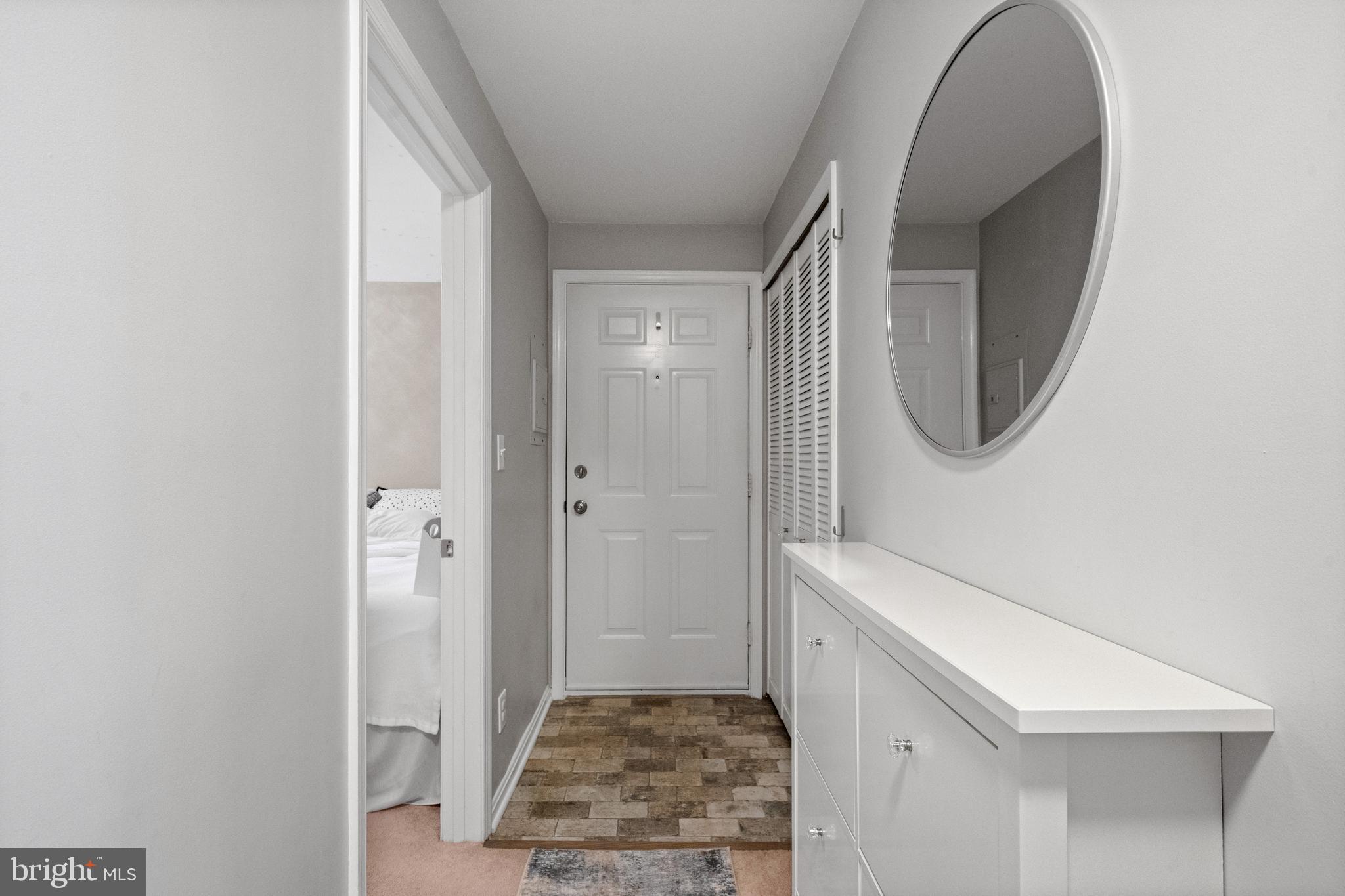 6022 Curtier Drive, Unit E Alexandria, VA 22310 - Photo 2 of 38 a bathroom with a sink and a mirror