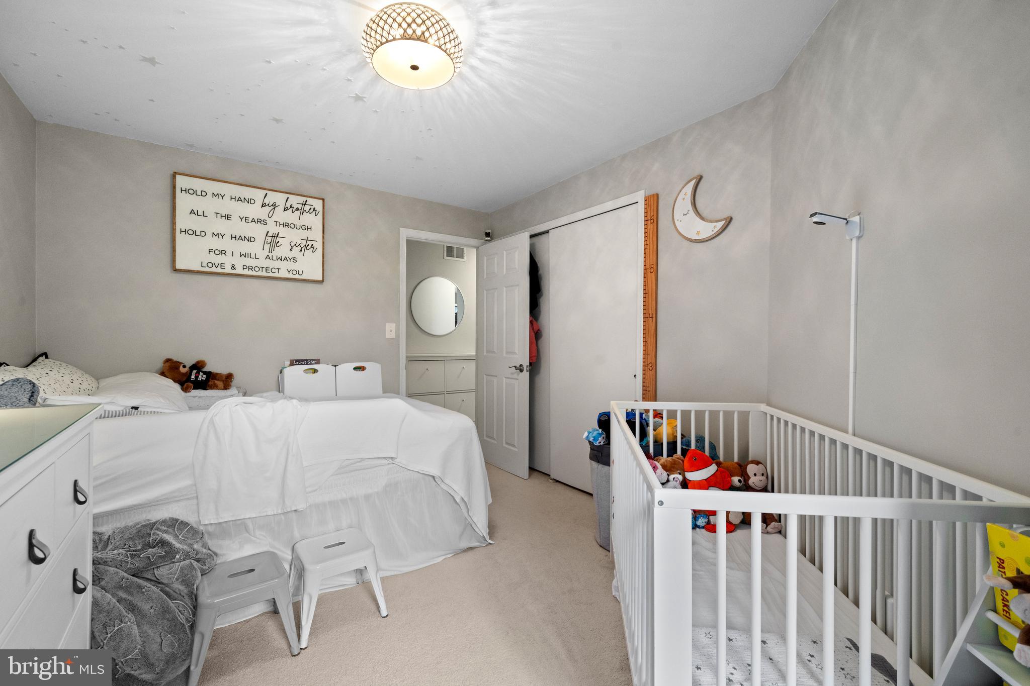 6022 Curtier Drive, Unit E Alexandria, VA 22310 - Photo 21 of 38 a bedroom with a bed and a window