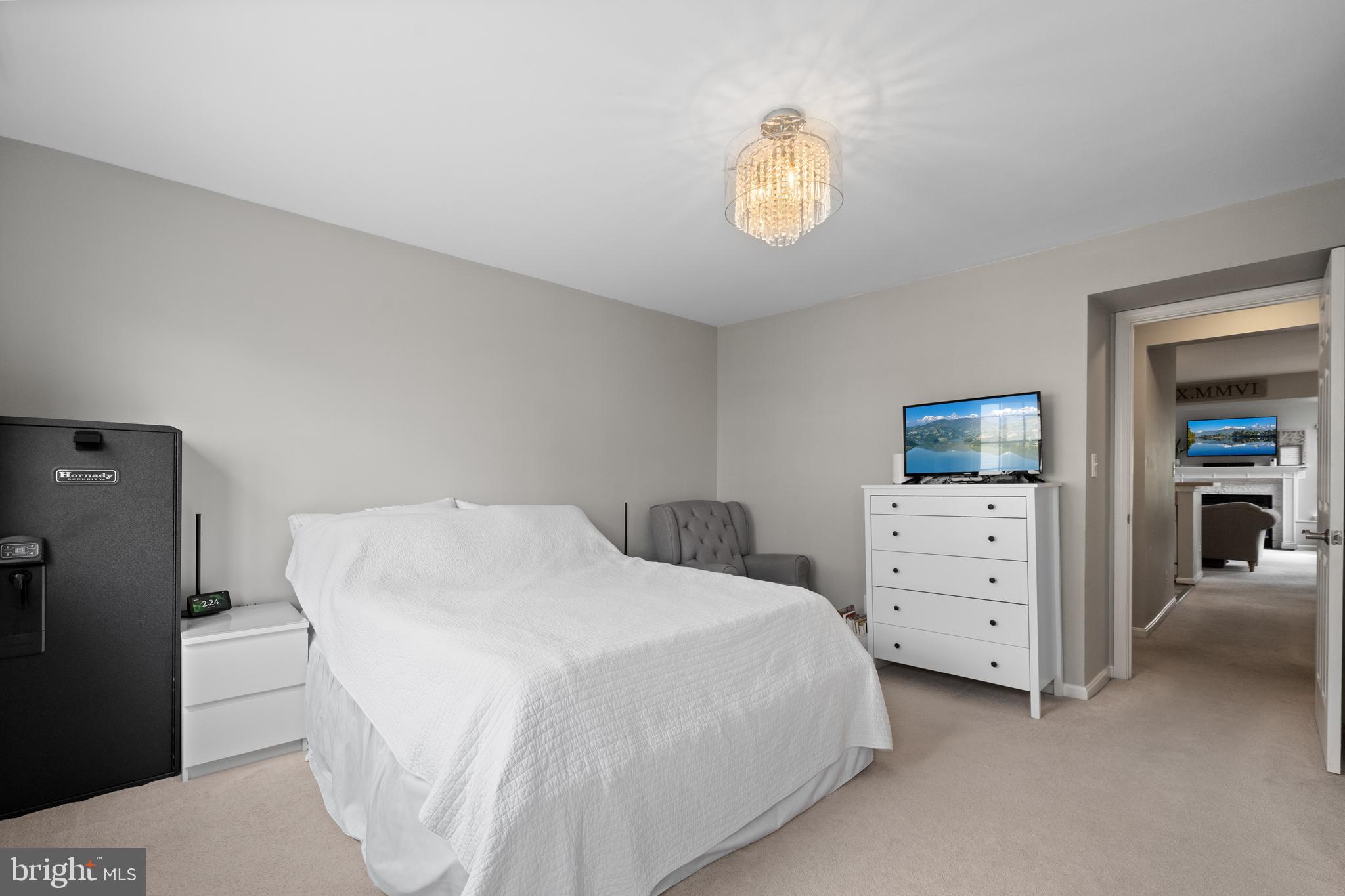 6022 Curtier Drive, Unit E Alexandria, VA 22310 - Photo 24 of 38 a bedroom with a bed and a dresser