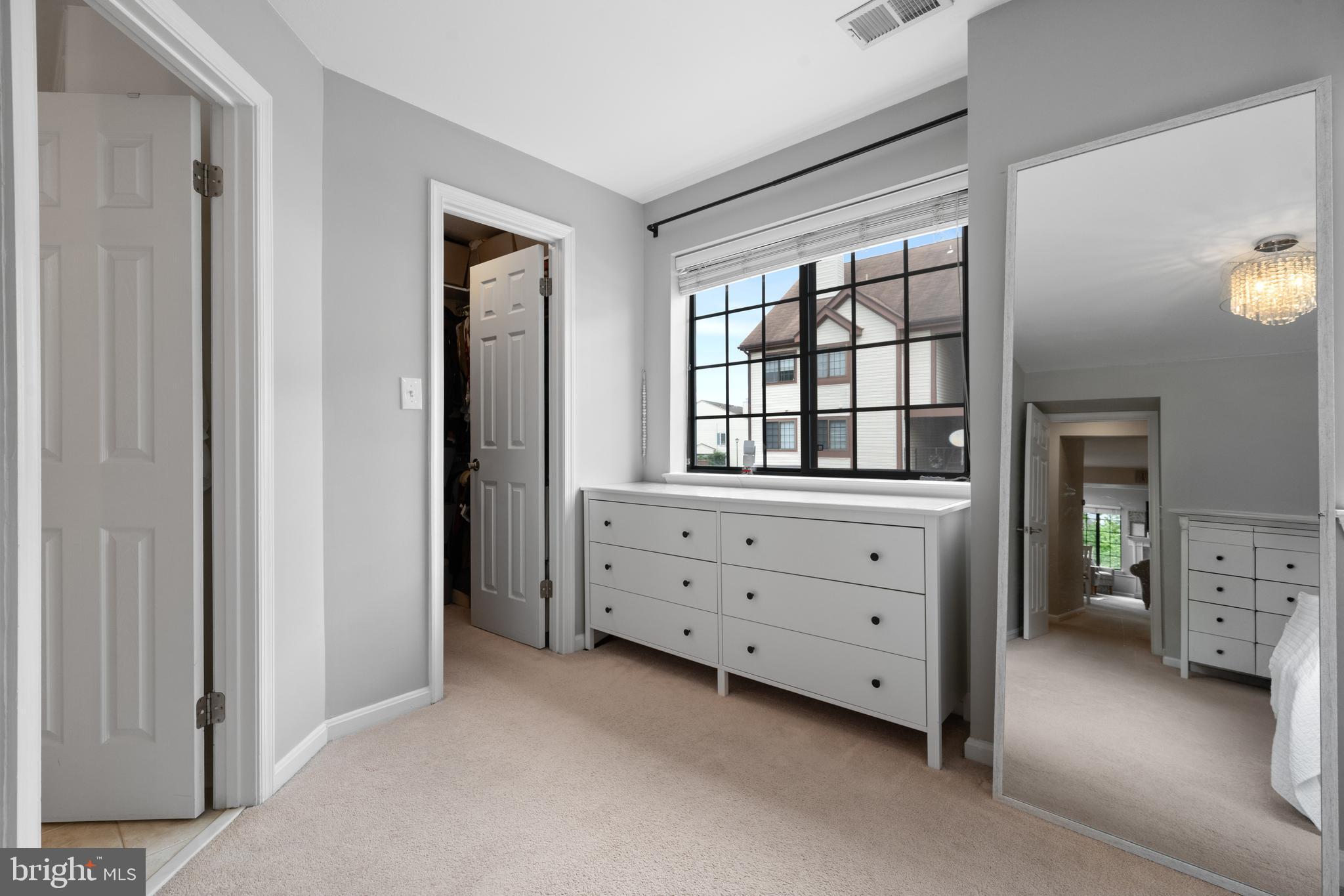 6022 Curtier Drive, Unit E Alexandria, VA 22310 - Photo 26 of 38 a room with window and cabinet